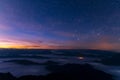 Landscape / starscape of the mountain and sea of mist in winter sunrise view from top of Doi Pha Tang mountain , Chiang Rai, Royalty Free Stock Photo