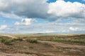 Landscape steppe. Tyva. The road near the lake Dus-Khol. Sunny day. Clouds. Royalty Free Stock Photo