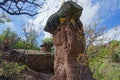 Landscape with stone mushrooms in the Crimea on a clear sunny day. Huge stone blocks, similar to mushrooms, against a Royalty Free Stock Photo