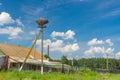 Landscape with stork nest on an electricity pole Royalty Free Stock Photo