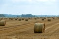 Landscape with straw rolls on a fallow field, late summer in nature