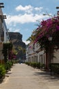 Street with white houses and colorful flowers, small fishing village. Romantic architecture of the port of Mogan in Gran Canaria, Royalty Free Stock Photo