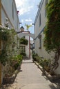 Street with white houses and colorful flowers, small fishing village. Romantic architecture of the port of Mogan in Gran Canaria, Royalty Free Stock Photo