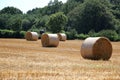 Landscape with a stubble field with straw bales Royalty Free Stock Photo