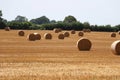 Landscape with a stubble field with straw bales Royalty Free Stock Photo
