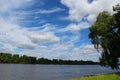 Landscape summer or spring with a beautiful blue sky white clouds, river and trees in daytime.