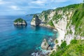 Landscape of sunny day with turquoise ocean, blue sky and mountains. View of Diamond beach, Nusa Penida, Bali island, Indonesia.