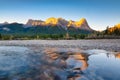 Landscape during sunrise. Autumn trees on the river bank. Mountains and forest. Reflections on the surface of the river. Vivid col Royalty Free Stock Photo