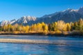 Landscape during sunrise. Autumn trees on the river bank. Mountains and forest. Reflections on the surface of the river. Vivid col Royalty Free Stock Photo