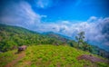 Landscape of sunrise on Green mountains and beautiful sky clouds under the blue sky, Dramatic moving cloud in nature landscape,