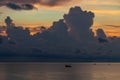 Landscape sunrise on the island of Phu Quoc, Vietnam. Morning sky, storm clouds, fishing boat and sea water Royalty Free Stock Photo