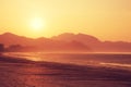 landscape of sunrise over mountains at coast Royalty Free Stock Photo