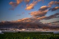 Landscape sunset beautiful view of tree bananas plantation and mountains in background with colorful amazig clouds in the blue sky