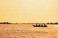 Landscape at sunset of a boat with fishermen fishing on Pantanal