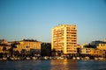 Landscape at sunset with the buildings on the other side of the city and boats Royalty Free Stock Photo