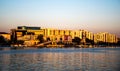 Landscape at sunset with the buildings on the other side of the city and boats Royalty Free Stock Photo