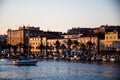 Landscape at sunset with the buildings on the other side of the city and boats Royalty Free Stock Photo