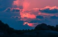 Landscape of sunset with dramatic sky and rock island and sea. Royalty Free Stock Photo