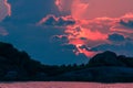 Landscape of sunset with dramatic sky and rock island and sea. Royalty Free Stock Photo