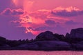 Landscape of sunset with dramatic sky and rock island and sea. Royalty Free Stock Photo