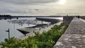 Landscape at sunset of the fishing port with little boats at low tide from the wall Royalty Free Stock Photo