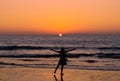 Landscape of sunset sunset on sea at Khaolak beach with defocused silhouette happy woman standing looking at view freedom raise Royalty Free Stock Photo