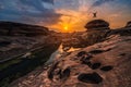 Landscape of sunset with silhouette happy man at Sam Phan Bok in Ubonratchathani unseen in Thailand. The Grand Canyon of Thailand