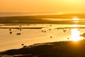 Sunset view of ocean and silhouette of boats in the Algarve