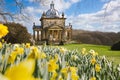 Landscape of The Temple of the Four Winds in the gardens of Castle Howard with wild daffodils