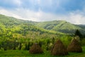 Landscape with three hayricks in mountains. Carpathian. Royalty Free Stock Photo