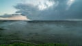 Landscape timelapse of moving fog in the dunes of Hvide Sande in Denmark after sunrise