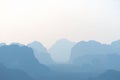 Tonal perspective of blue silhouettes of mountains and hills in asian valley