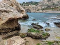 Landscape with town, sea, water, rocks and sky in Taormina beach. Royalty Free Stock Photo