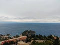 Landscape with town sea, water, rocks and sky in Taormina beach. Royalty Free Stock Photo