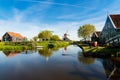 Landscape of traditional Dutch windmills and houses