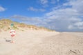 Landscape with a traffic sign and a lifebuoy on the deserty road Royalty Free Stock Photo