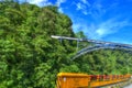 Landscape of Train Bridge Though the Forest with Car Bridge Fence and Blue Sky Royalty Free Stock Photo