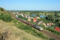 Landscape with the train, village and river Royalty Free Stock Photo