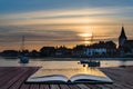 Landscape tranquil harbour at sunset with yachts in low tide Creative concept