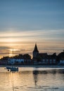 Landscape tranquil harbour at sunset with yachts in low tide