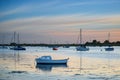 Landscape tranquil harbour at sunset with yachts in low tide