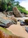 Landscape of tropical beach in the lagoon with big rocks and cliffs