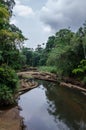 Landscape with tropical river flowing peacefully through lush rain forest of Nigeria, Africa Royalty Free Stock Photo