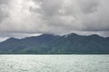 Landscape with tropical sea, monsoon storm heavy clouds and tropical Koh Chang island on horizon in Thailand Royalty Free Stock Photo