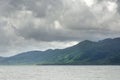 Landscape with tropical sea, monsoon storm heavy clouds and tropical Koh Chang island on horizon in Thailand Royalty Free Stock Photo