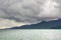 Landscape with tropical sea, monsoon storm heavy clouds and tropical Koh Chang island on horizon in Thailand Royalty Free Stock Photo