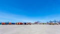 Landscape of truck, containers and crane at trade port Royalty Free Stock Photo