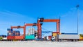 Landscape of truck, containers and crane at trade port Royalty Free Stock Photo