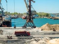 Landscape of tugboats and cranes in shipyard in coast Royalty Free Stock Photo