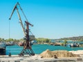 Landscape of tugboats and cranes in shipyard in coast Royalty Free Stock Photo